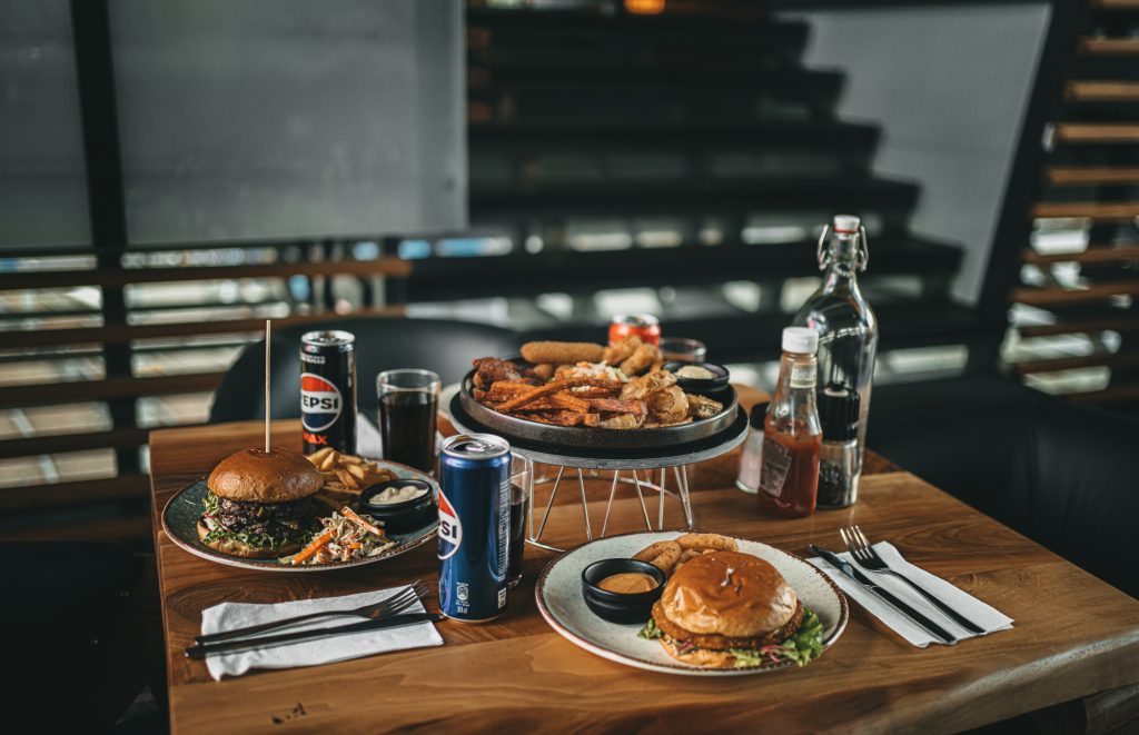 photo of a table with streetfood burgers and siders